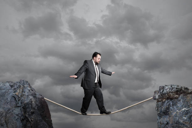 istock Businessman balancing on rope 1132874920