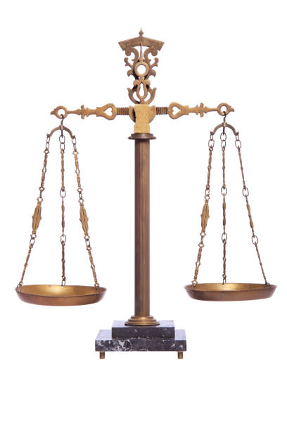 istock An antique balance scale isolated on white 1132875053