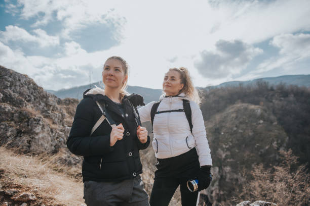istock Friends on the mountain peak 1132881691