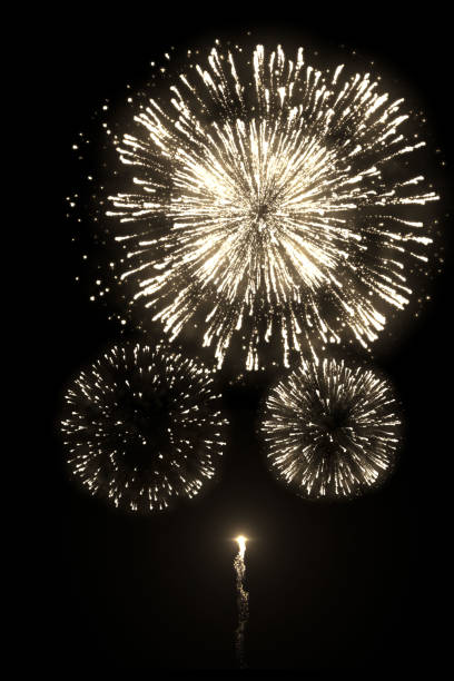 A high-quality image of beautiful golden fireworks with trail isolated on the black background for overlay design of celebration new year or festivals