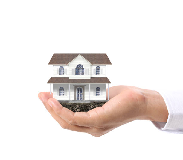 istock Mortgage concept by house  in hand 1132887233