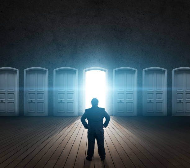 istock Businessman choice lighted door 1132887498