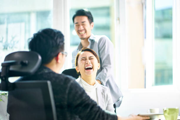 istock young asian corporate executives laughing during discussion 1132890521