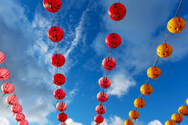 istock Colorful Chinese Lanterns in a Row Against Blue Sky 1132890930