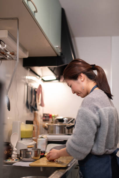 istock Woman cooking in kitchen 1132892449