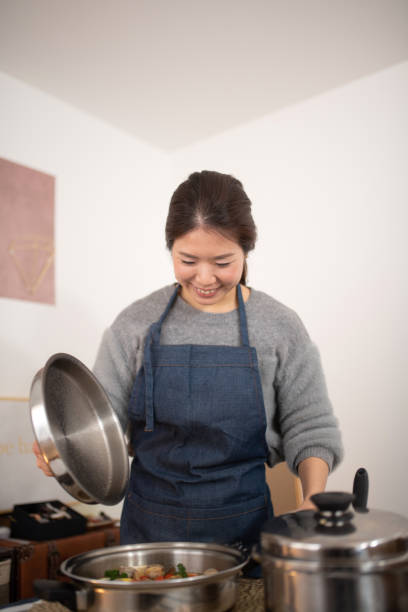 istock Woman preparing for meal at home 1132892521