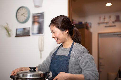 Woman preparing for meal at home