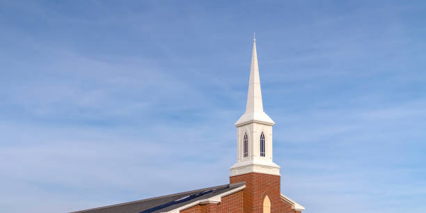 istock Church steeple with cloudy blue sky background 1132892671