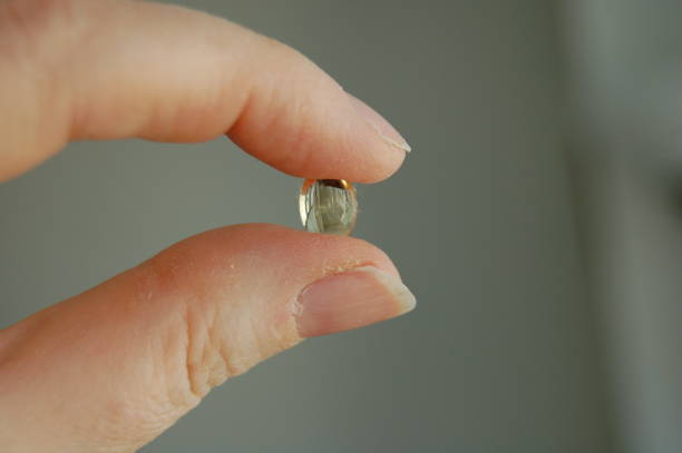 istock Holding a single vitamin gelcap 1132896965