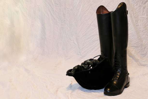 istock English Riding Boot with helmet background 1132898313