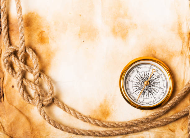 istock old compass and rope on grunge background 1132902230