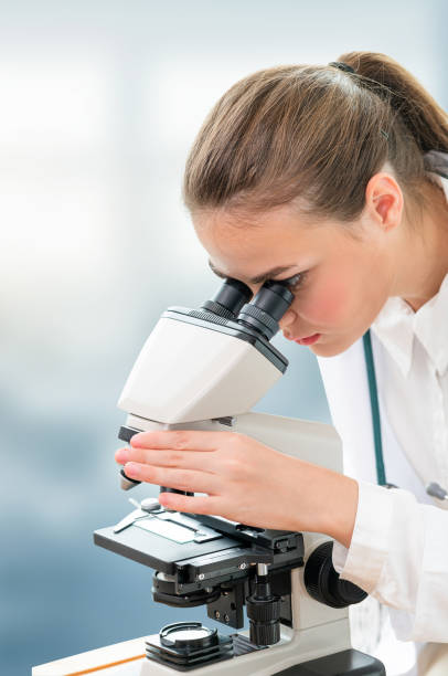 istock Scientist researcher using microscope in laboratory. Medical healthcare technology and pharmaceutical research and development concept. 1132905235