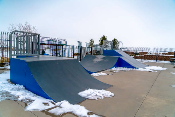 istock Skateboard ramps and melting snow on a skate park 1132906920