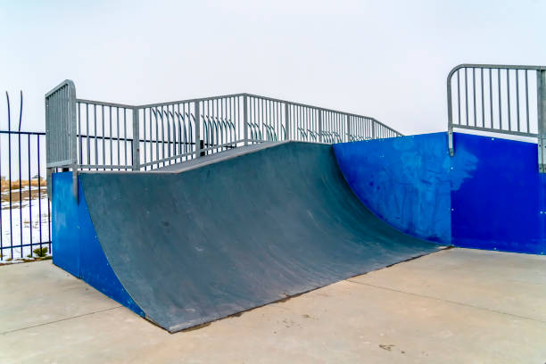 istock Skateboarding ramp with snow and sky background 1132906928
