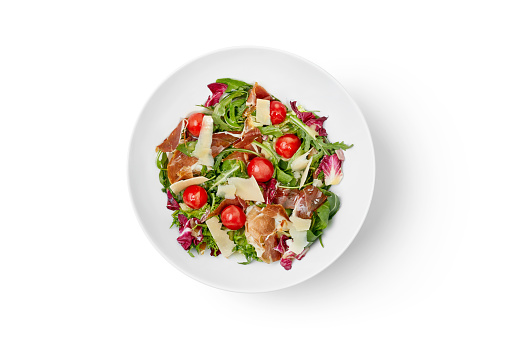 top view of white bowl with salad isolated on white background