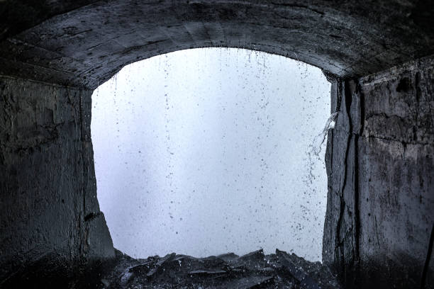 Wet Cave View of Niagara streams from the cave of the Journey Behind The Falls experience falling behind stock pictures, royalty-free photos & images