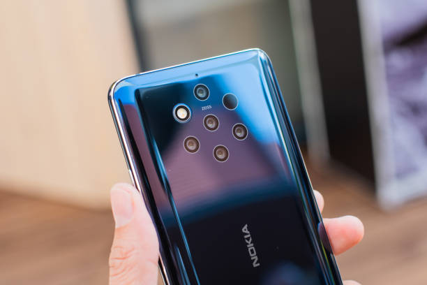 Nokia 9 PureView Ho Chi Minh / Vietnam, Mar 2019 - The Nokia 9 PureView phone, notable for its five-camera ring in review. phone nokia stock pictures, royalty-free photos & images
