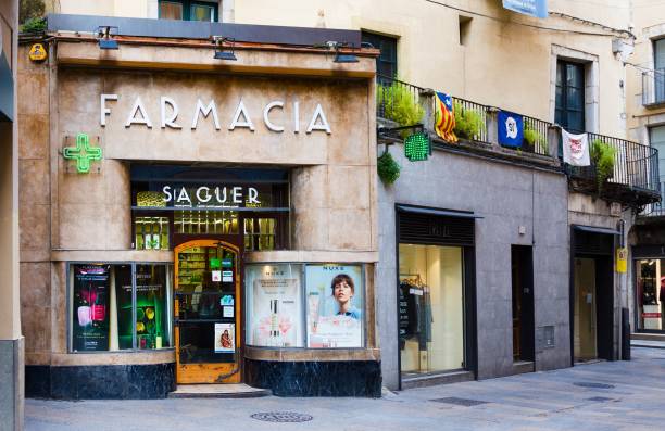 Pharmacy in Old Town, Girona, Catalyna, Spain Girona, Spain - January 23, 2019: Pharmacy in Old Town, Girona, Catalyna, Spain farmacia stock pictures, royalty-free photos & images