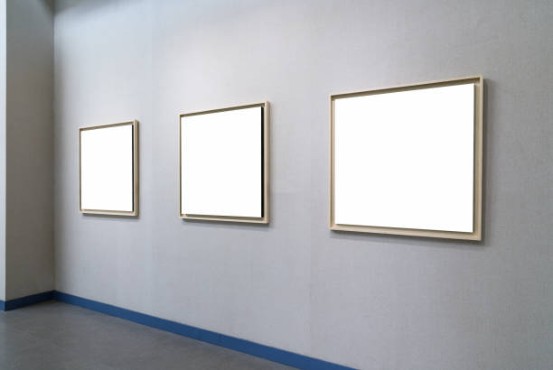 blank picture frames with clipping path on exhibition wall