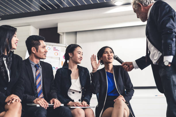 istock Senior leader speaker speaks to public people audience in training workshop or conference. Mature lecturer is CEO executive manager leading the symposium event. International business seminar concept. 1132916484