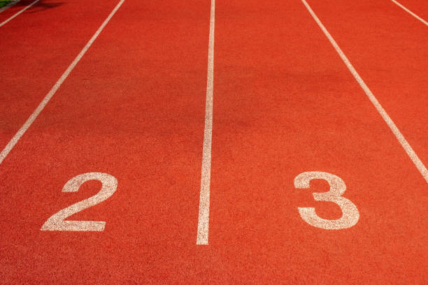 istock Red running track Synthetic rubber on the athletic stadium 1132917561
