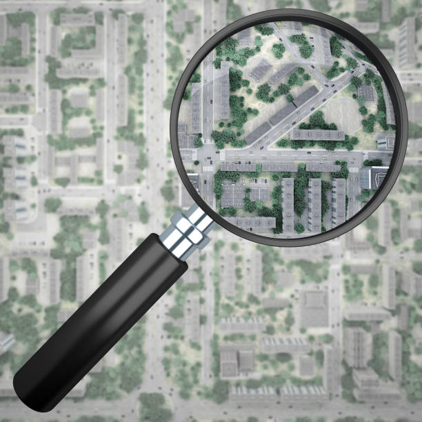 istock magnifier over City top view 1132918156