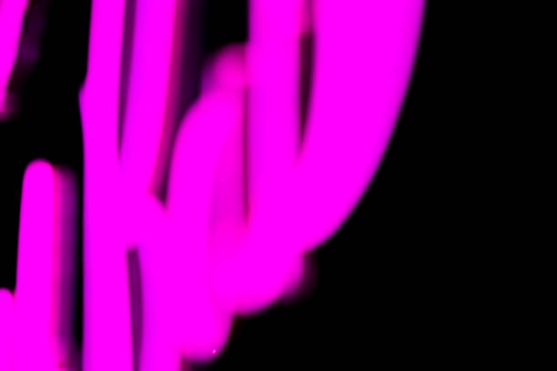 istock Abstact blurred purple neon sign on black background. 1132918834