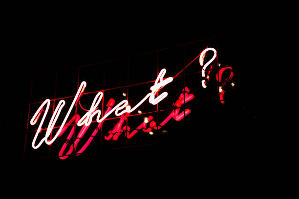istock Question What in red neon color on black background. 1132918935