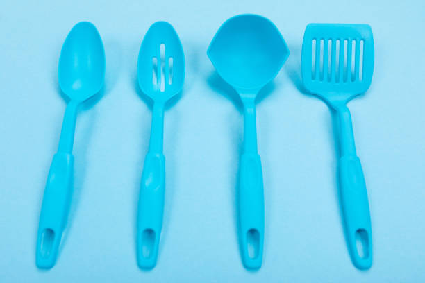 Design concept of kitchen utensils isolated on blue background