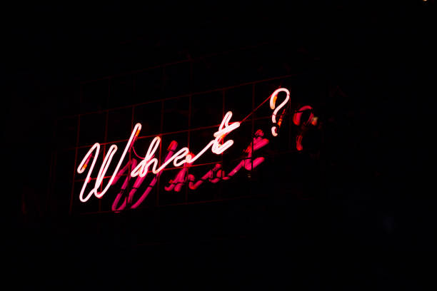 istock Question What in red neon color on black background. 1132918943