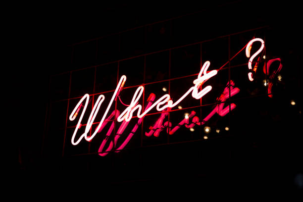 istock Question What in red neon color on black background. 1132918946