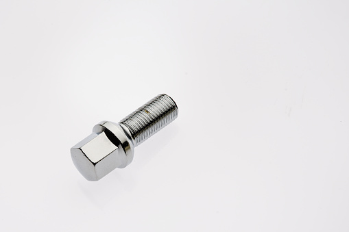 One car wheel bolts isolated on white background with copyspase - Image