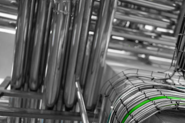 istock Industrial pipelines and modern equipment in cheese production interior 1132921130