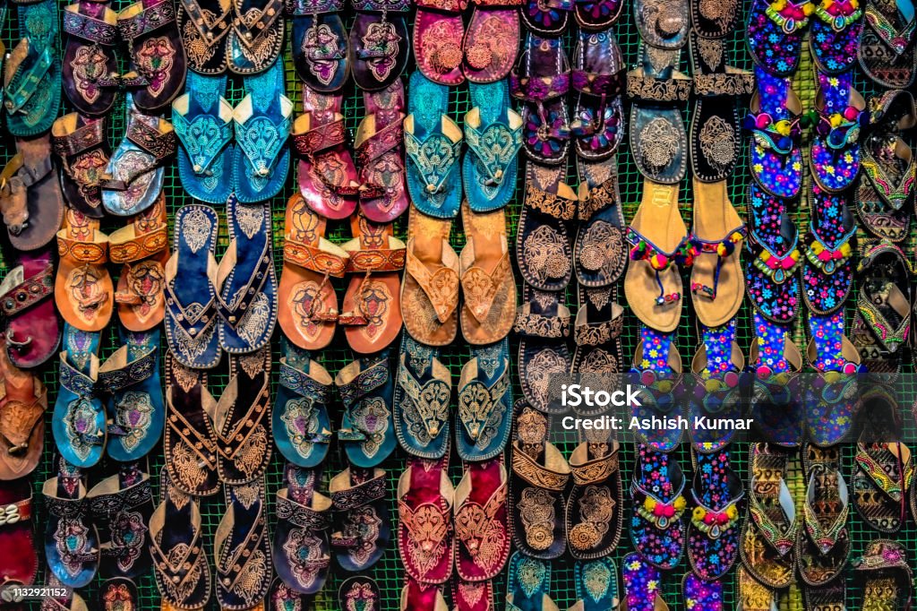 Kolhapuri Chappal- Colorful and variety of Ladies Ethnic Footwear displayed on sale at the street market in India. Kolhapuri Chappal in India are usually wore with Ethnic wear of Indian Culture. Kolhapuri Chappal- Colorful and variety of Ladies Ethnic Footwear displayed on sale at the street market in India. Kolhapuri Chappal in India are usua Kolhapur Stock Photo