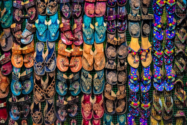 Kolhapuri Chappal- Colorful and variety of Ladies Ethnic Footwear displayed on sale at the street market in India. Kolhapuri Chappal in India are usually wore with Ethnic wear of Indian Culture. Kolhapuri Chappal- Colorful and variety of Ladies Ethnic Footwear displayed on sale at the street market in India. Kolhapuri Chappal in India are usua kolhapur stock pictures, royalty-free photos & images