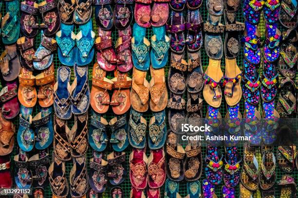 Kolhapuri Chappal Colorful And Variety Of Ladies Ethnic Footwear Displayed On Sale At The Street Market In India Kolhapuri Chappal In India Are Usually Wore With Ethnic Wear Of Indian Culture Stock Photo - Download Image Now