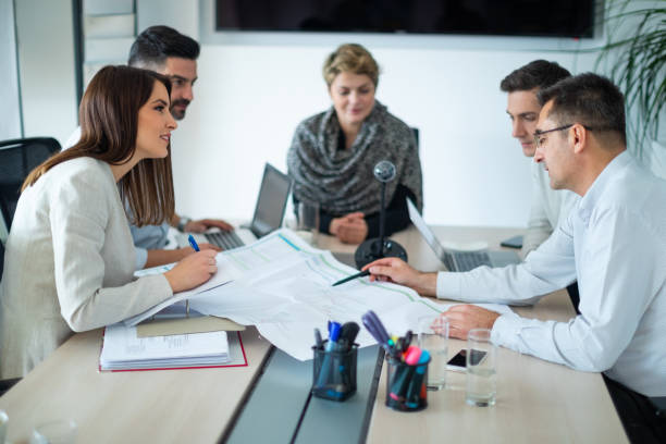 istock Coworkers analyzing success chart on a meeting 1132921228