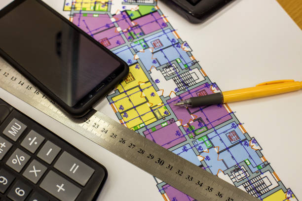 istock Calcurator, pen and ruler on building house architecture plan drawing blueprint. Planning, measurement and investments concept. 1132922697