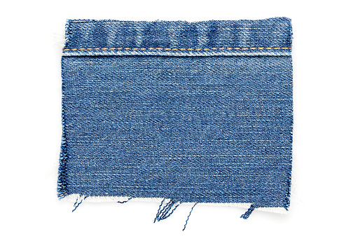cut piece of denim with stitch isolated on white