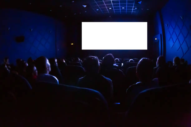 people in the cinema watching a movie. blank empty white screen - full screen imagens e fotografias de stock