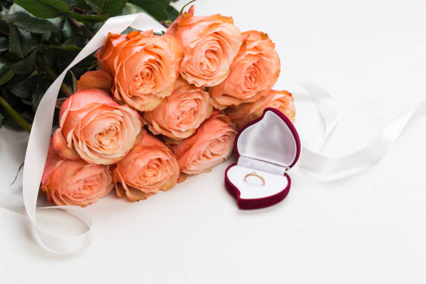 istock pink roses and box holding wedding ring -  Image 1132925714