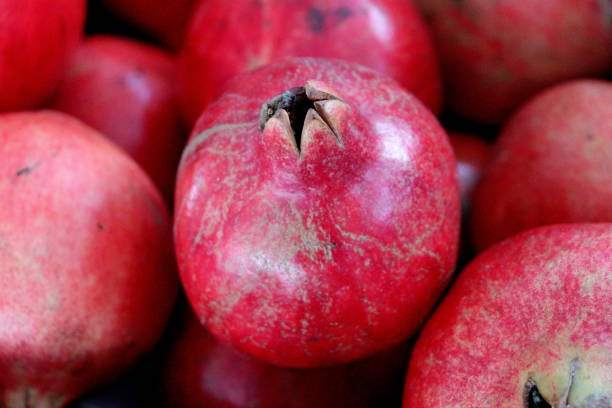 istock pomegranates in the market 1132925829