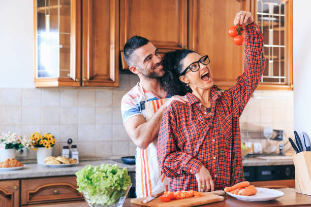 istock Woman preparing salad in ktichen 1132927365