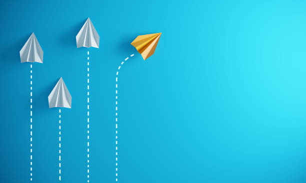 Leadership Concept With Paper Airplanes Group of paper plane in one direction and with one individual pointing in the different way, can be used leadership/individuality concepts.( 3d render ) concepts photos stock pictures, royalty-free photos & images