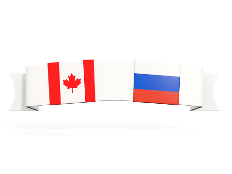 Jigsaw puzzle pieces textured with Canadian and Dutch flags on white. Horizontal composition with copy space. Clipping path is included.