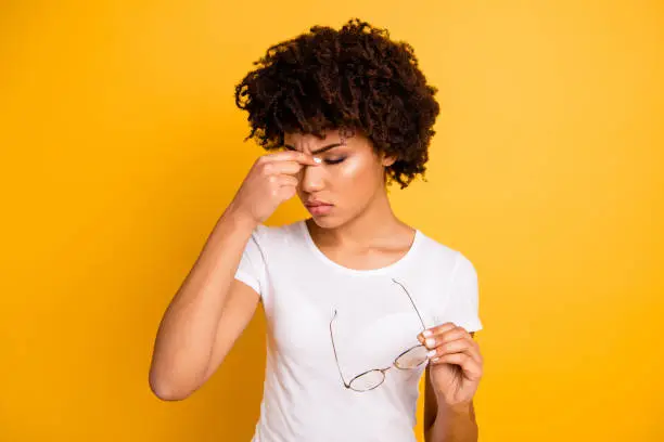 Portrait of her she nice attractive beautiful sad frustrated depressed tired wavy-haired lady touching nose having migraine attack isolated over bright vivid shine background.