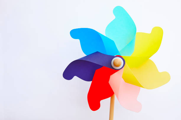 istock Multicolored pinwheel windmill toy isolated on white. Summer colors 1132933230
