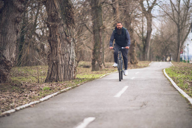 istock Man riding his bicycle out in nature 1132933690
