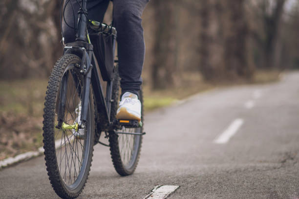 istock Man riding his bicycle out in nature 1132933828