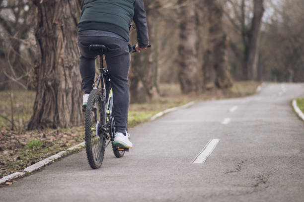 istock Man riding his bicycle out in nature 1132933866